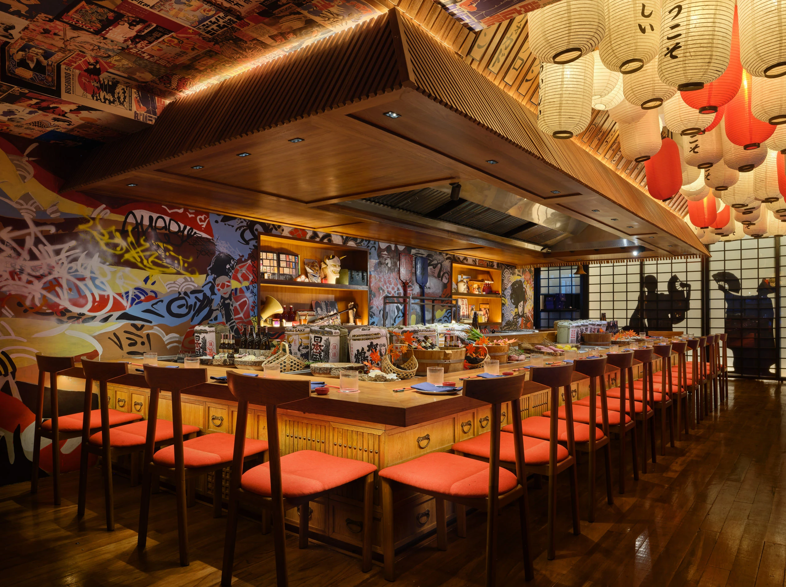 Robata grill counter with bar stools and hanging lanterns