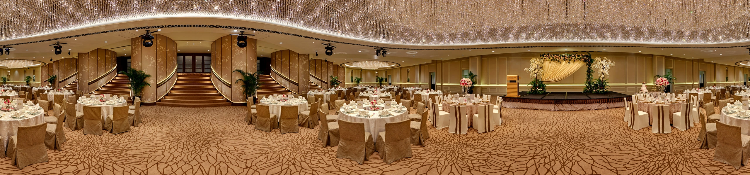360 panorama of The Fullerton Hotel Singapore ballroom with crystal chandelier ceiling, wedding banquet tables and grand staircase
