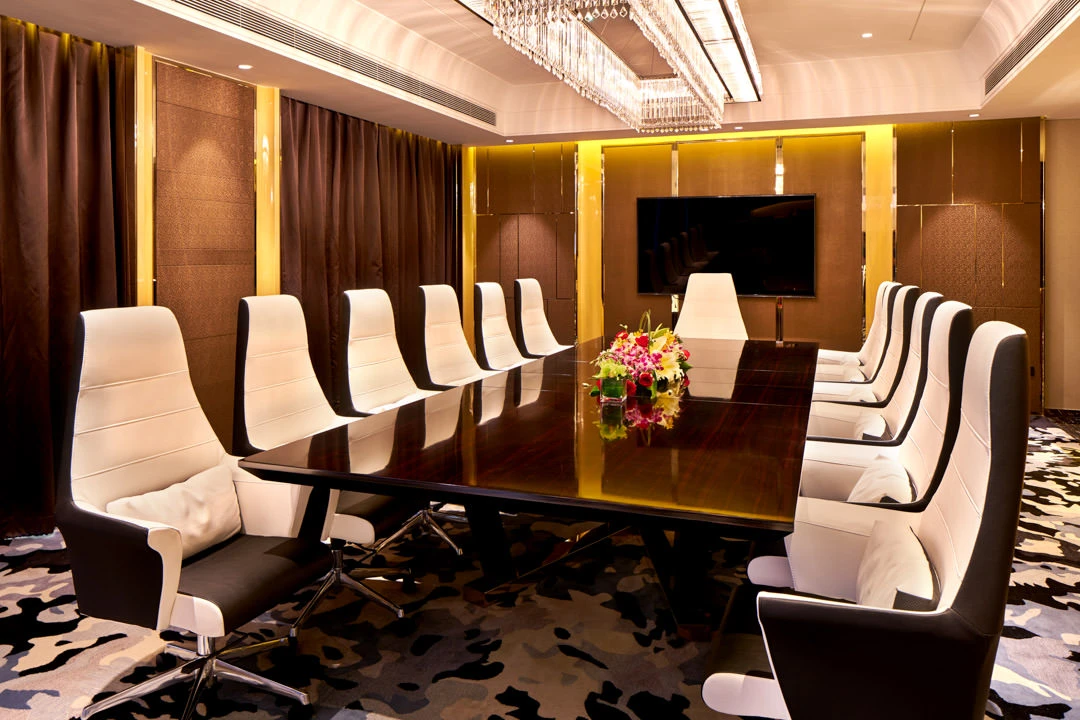 Executive boardroom with crystal chandelier and gold-lacquered panels — Crowne Plaza Beijing Lido function room photography