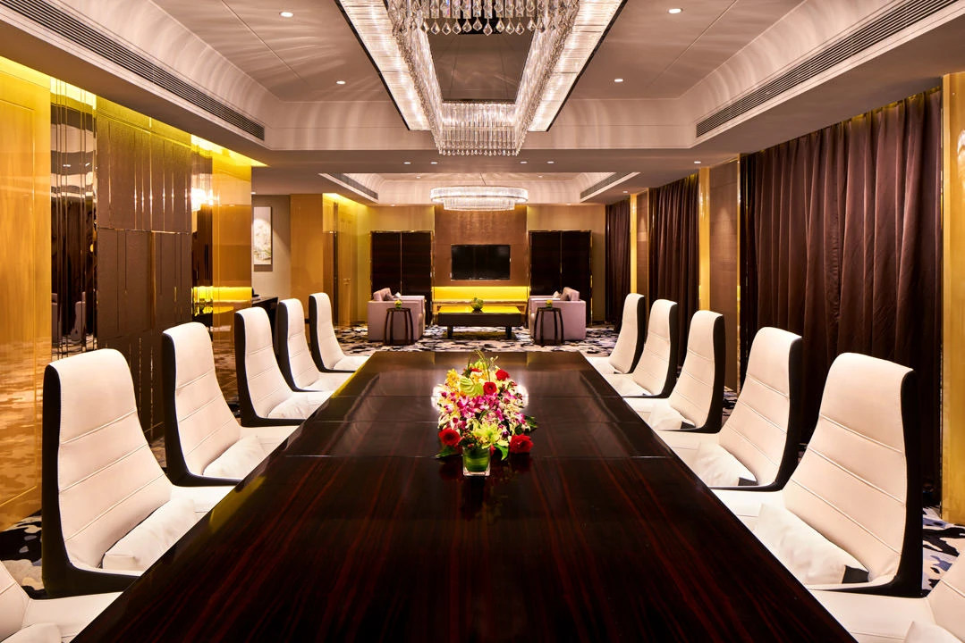 Wide boardroom with dual crystal chandeliers and lounge area — Crowne Plaza Beijing Lido meeting room photography
