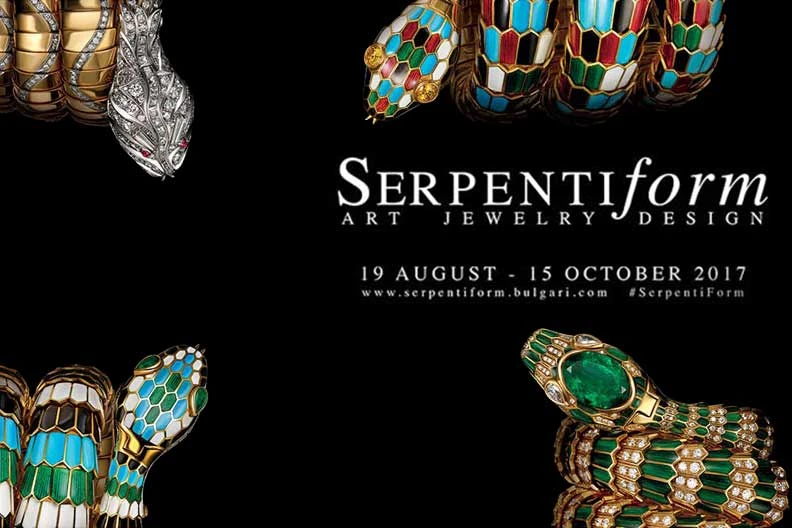 Serpent-shaped gold and enamel bracelets with emeralds and diamonds on black background with exhibition title and dates
