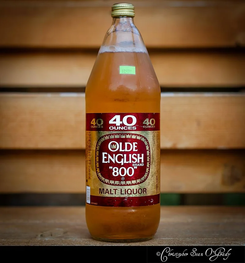 Olde English 800 malt liquor 40oz bottle on wooden pallet