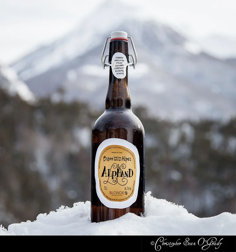 Alphand Blonde on snow with French Alps mountain backdrop