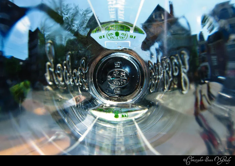 Grolsch beer bottle viewed from the bottom through the glass