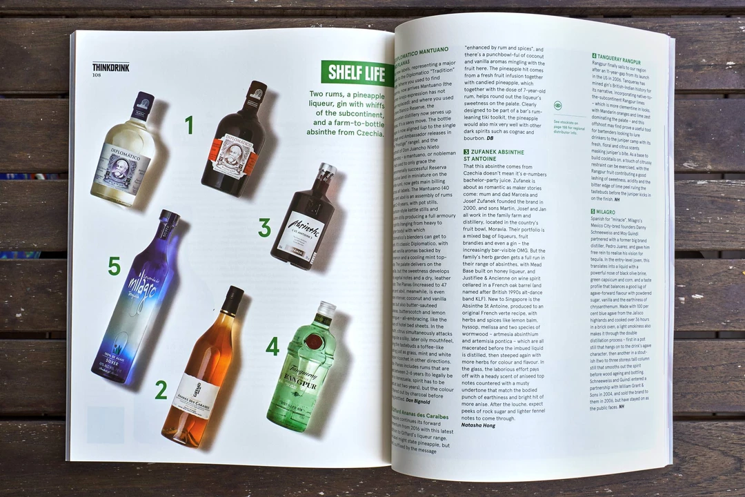 Spirits editorial spread with bottle lineup and magazine layout