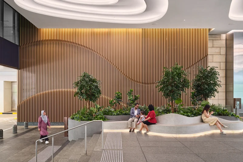 One Raffles Quay Garden Plaza interior seating area with timber wall and planting