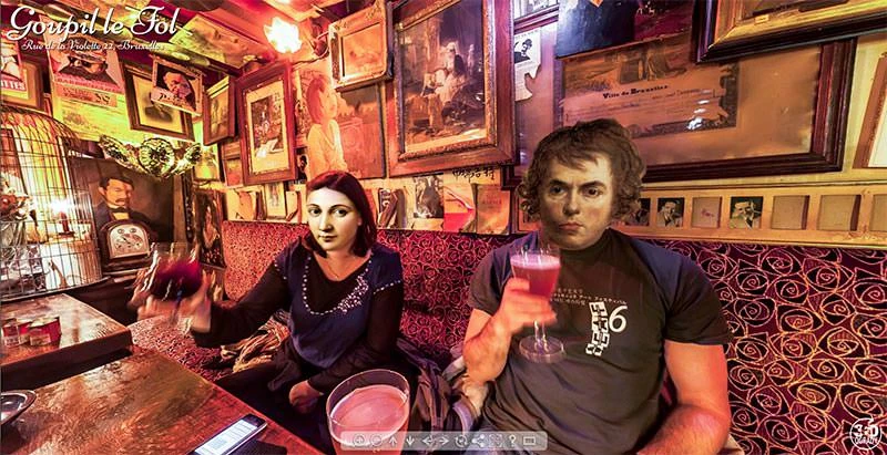 Quirky bar interior with books and pictures nailed to walls at Goupil Le Fol Brussels