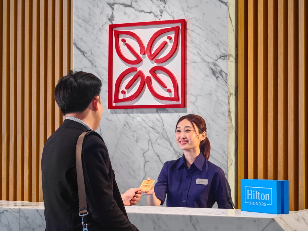 Hilton Garden Inn Singapore Serangoon front desk check-in with guest receiving key card