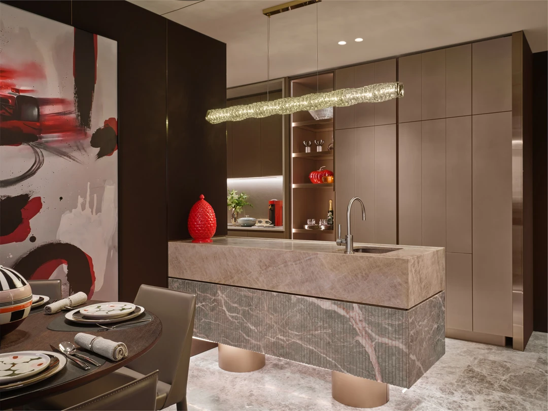 W Residences 3-bedroom showflat kitchen and dining area with stone island, pendant light and contemporary cabinetry