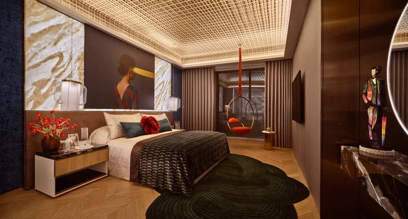 W Residences 5-bedroom showflat master bedroom with marble feature wall, lounge seating and dramatic ceiling detail