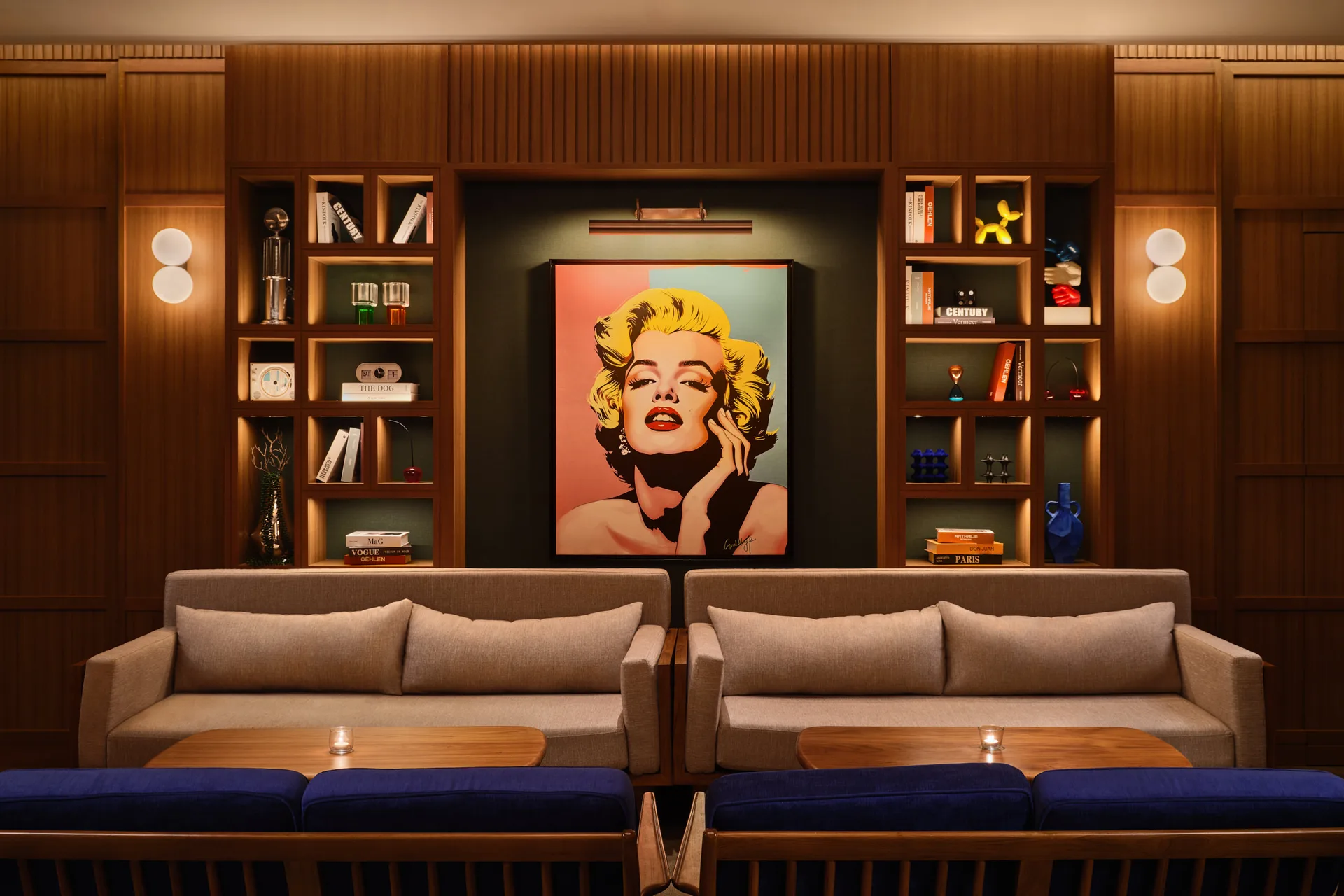 APT 101 Bangkok entertainment room lounge with sofas and statement art