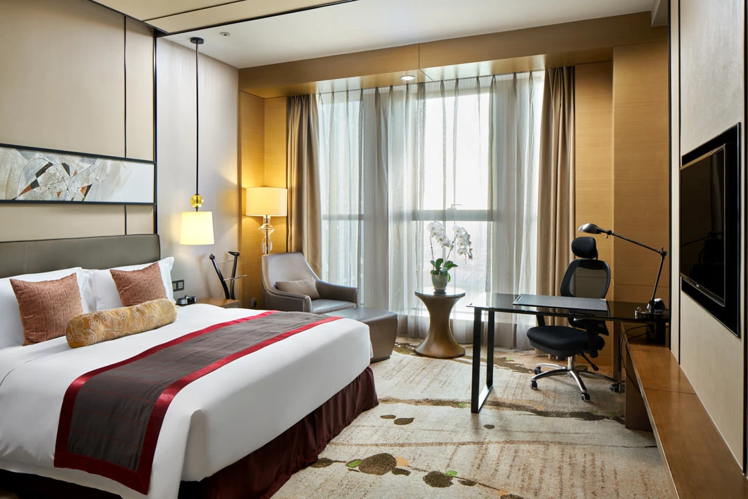 Superior king room with modern furnishings and neutral tones — Crowne Plaza Tianjin Meijiangnan hotel photography