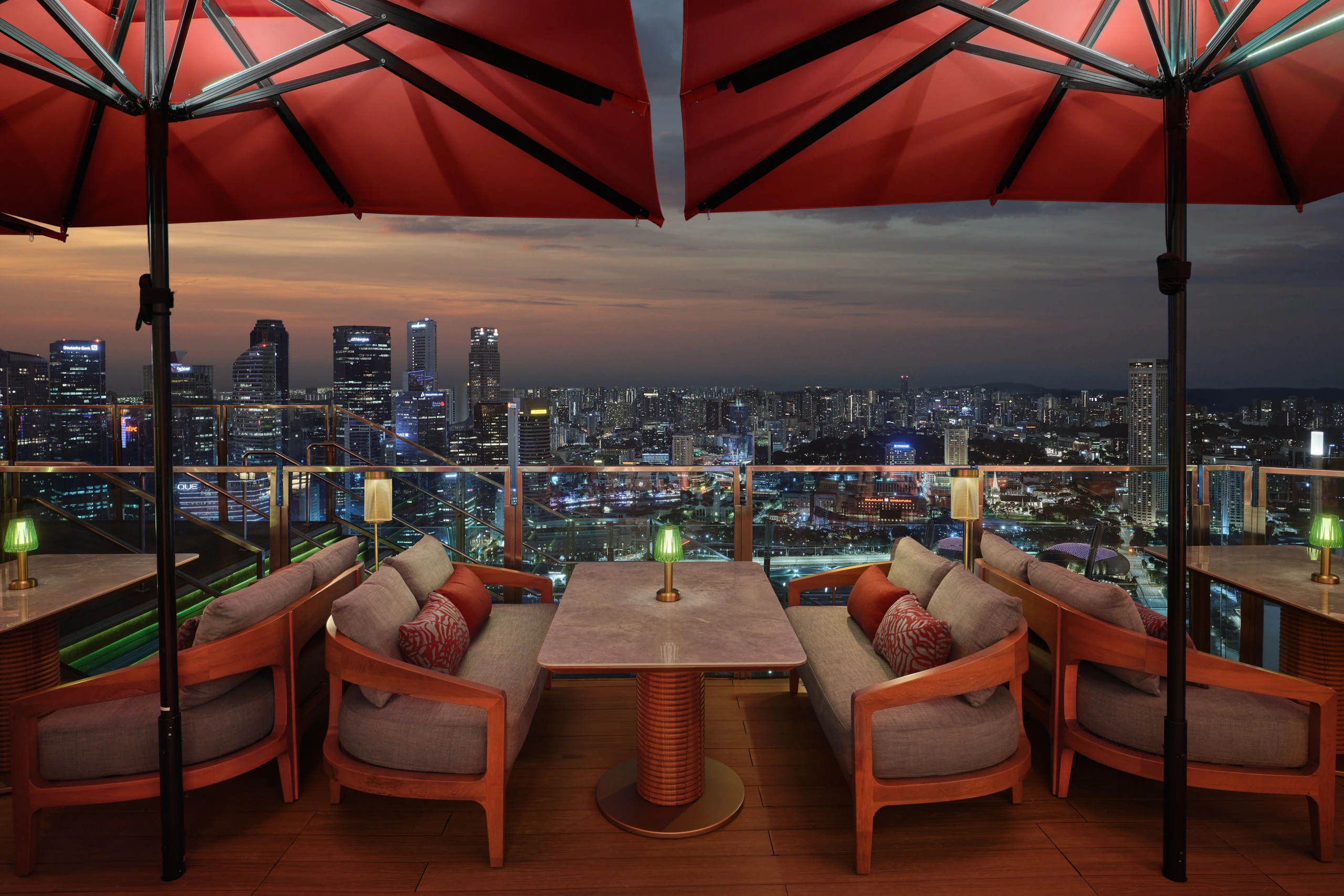 Ce La Vi Singapore lounge seating with sunset over the skyline