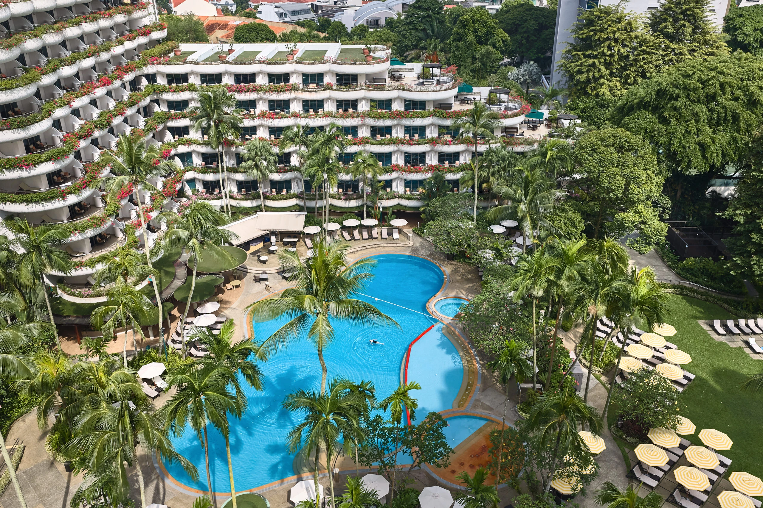 Aerial view of Shangri-La Hotel Singapore pool landscape and tropical gardens along Orange Grove Road