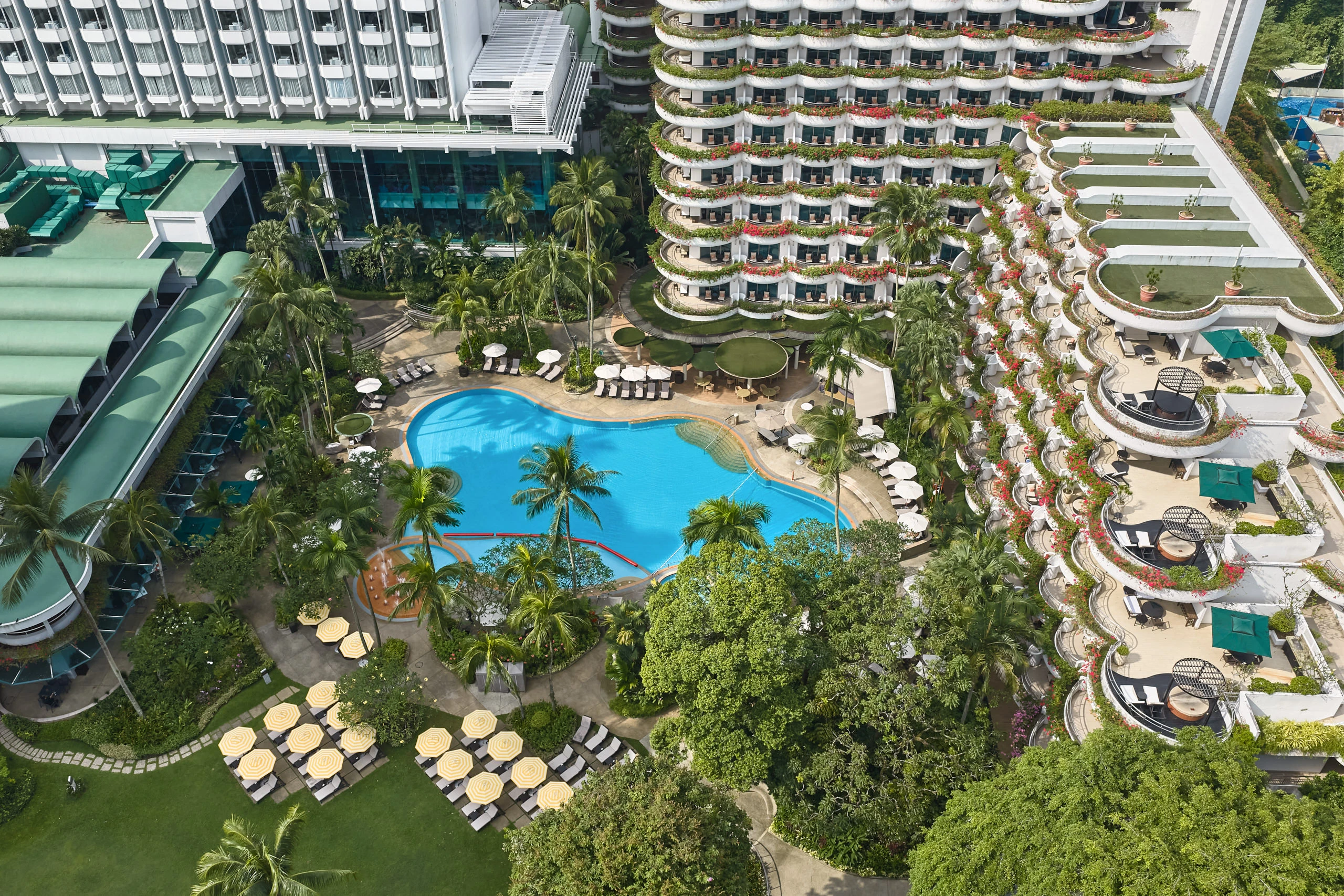 Shangri-La Hotel Singapore Valley Wing aerial view with pool terrace and Orchard Road skyline
