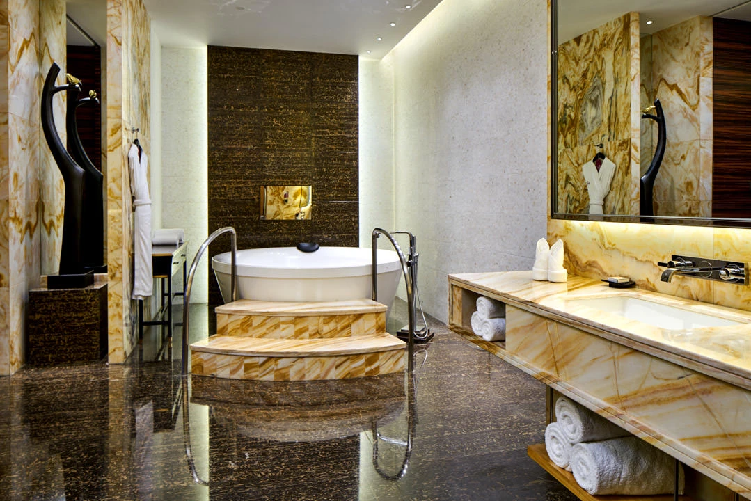Presidential suite bathroom with marble finishes and soaking tub — Crowne Plaza Tianjin Jinnan hotel photography