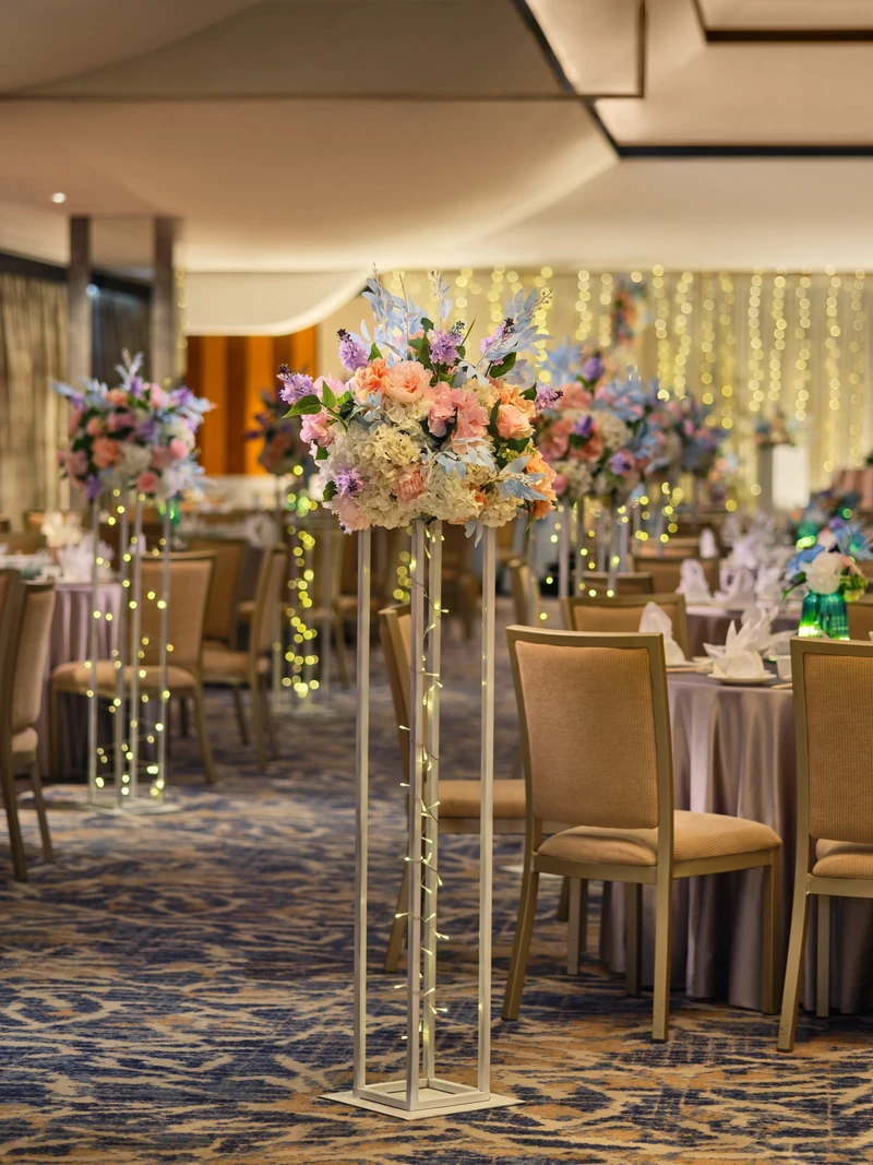 White floral aisle stands with peach roses and fairy lights - voco Orchard Singapore wedding venue photography