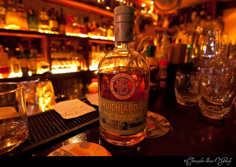 Bruichladdich 12-year Islay single malt scotch at a warmly lit whisky bar