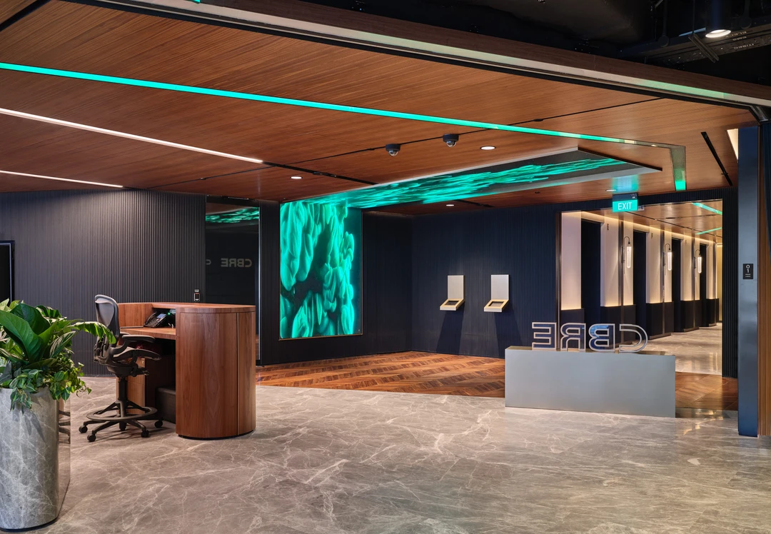 Reception with green moss wall art and contemporary seating