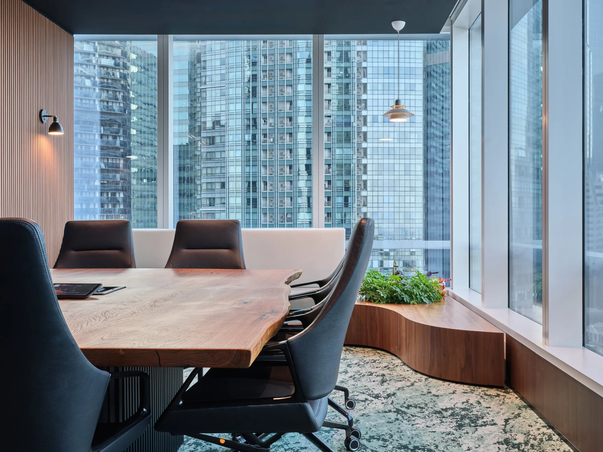 Boardroom with glass partitions and timber-panelled walls