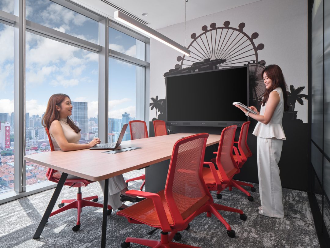 Modern office with city skyline view.