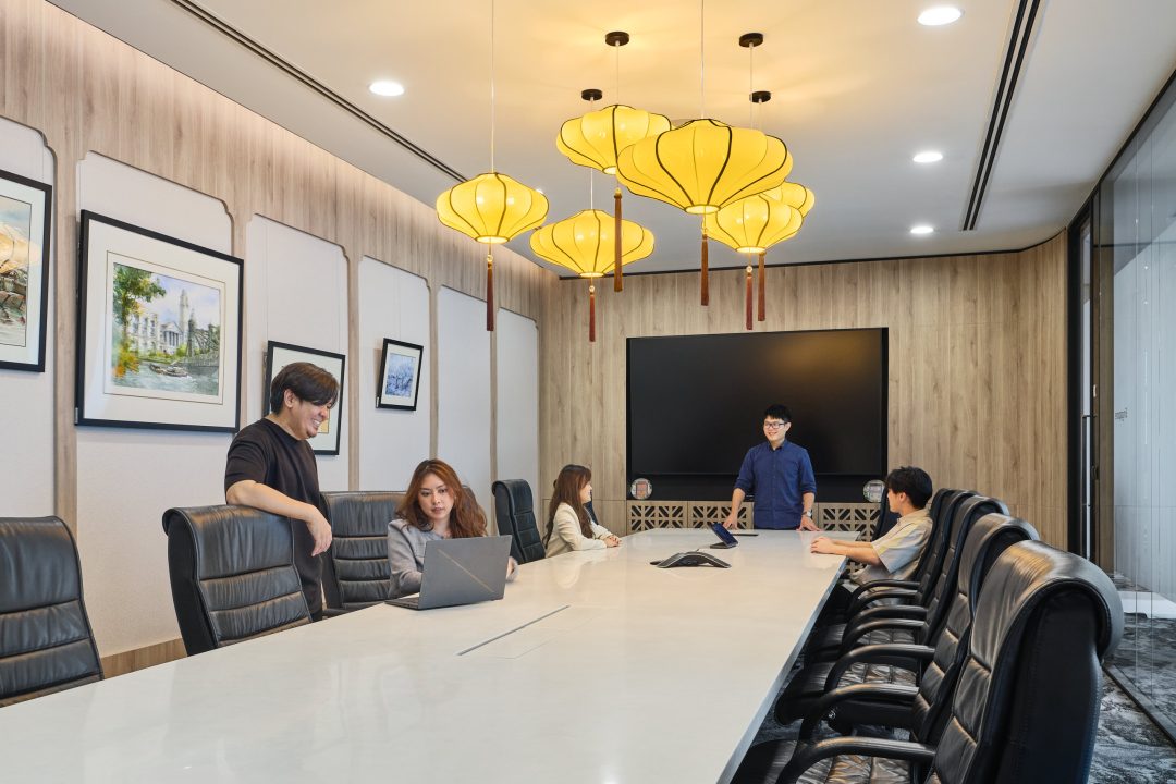 Business meeting in modern conference room.