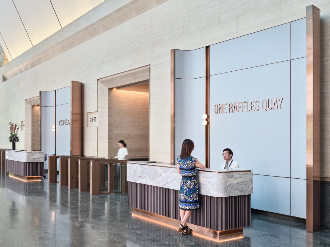 One Raffles Quay North Tower reception counter with building signage. Architectural photography for Gensler by Christopher O’Grady, Singapore.
